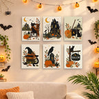 Six finished Salem Black Cat Autumn mini paintings hung on a wall above a table