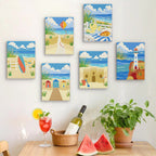 Six finished Sandy Summer mini paintings hung on a wall above a table