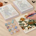 Painting one of the Scarecrow Harvest Friends designs next to a stack of mini canvases