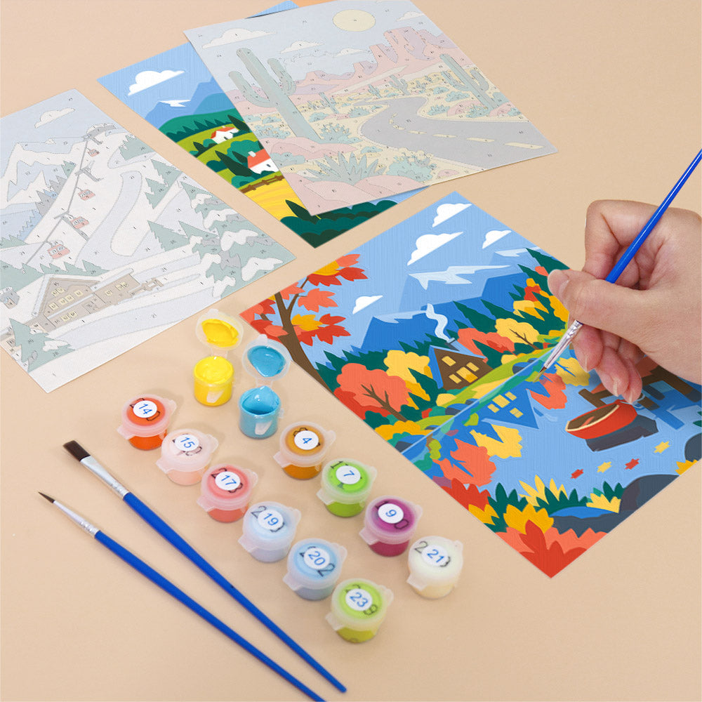 Filling in a Scenic Escapes mini canvas with numbered acrylic paints and a fine brush