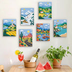 Six finished Scenic Escapes mini paintings hung on a wall above a table