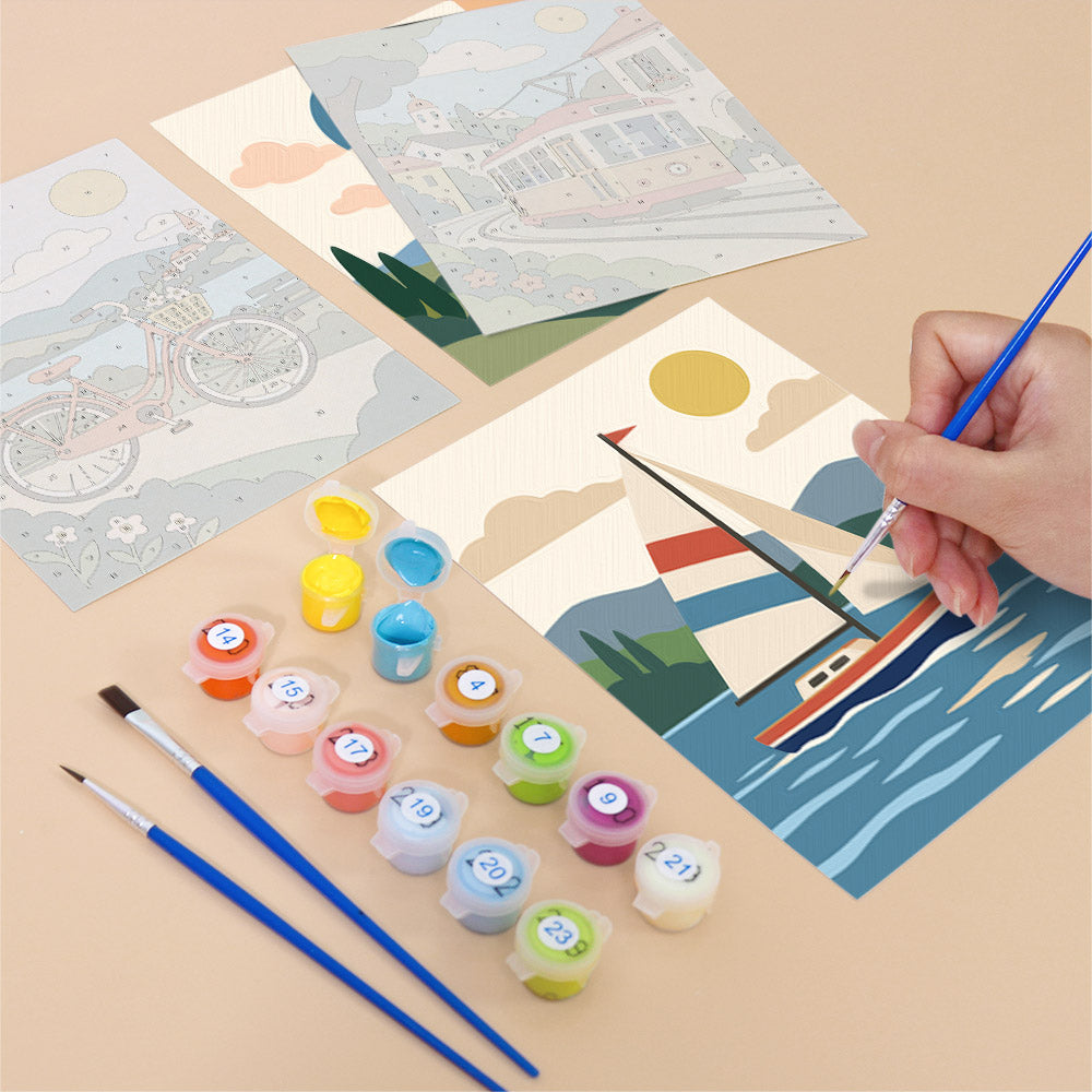 Filling in a Scenic Rides mini canvas with numbered acrylic paints and a fine brush