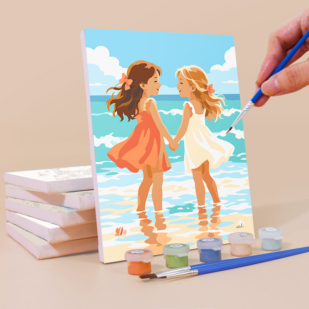 Painting a Seaside Friends mini canvas propped up beside numbered acrylic paints