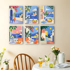 Seaside Terraces mini paintings displayed as a gallery wall in a sunny kitchen