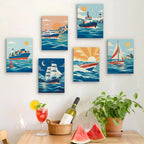 Six finished Ships and Sails mini paintings hung on a wall above a table