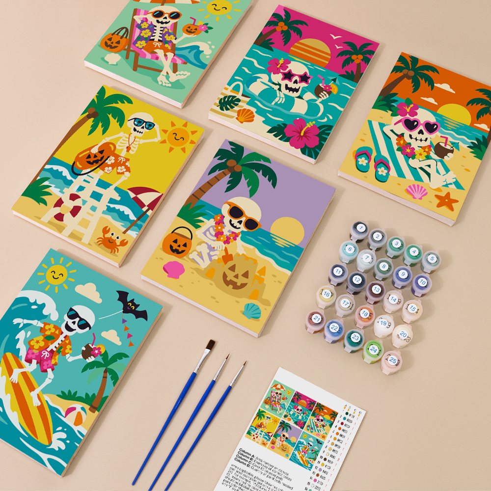 Painting one of the Skeleton Beach Holiday designs next to a stack of mini canvases