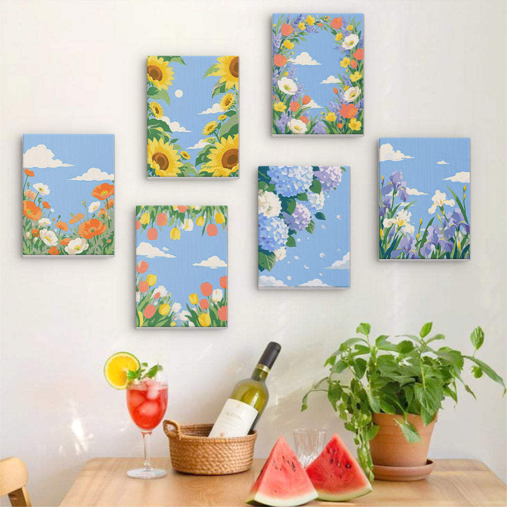 Six finished Sky Garden mini paintings hung on a wall above a table