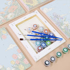Numbered paint pots and brushes on a pre-stretched Sky Garden mini canvas
