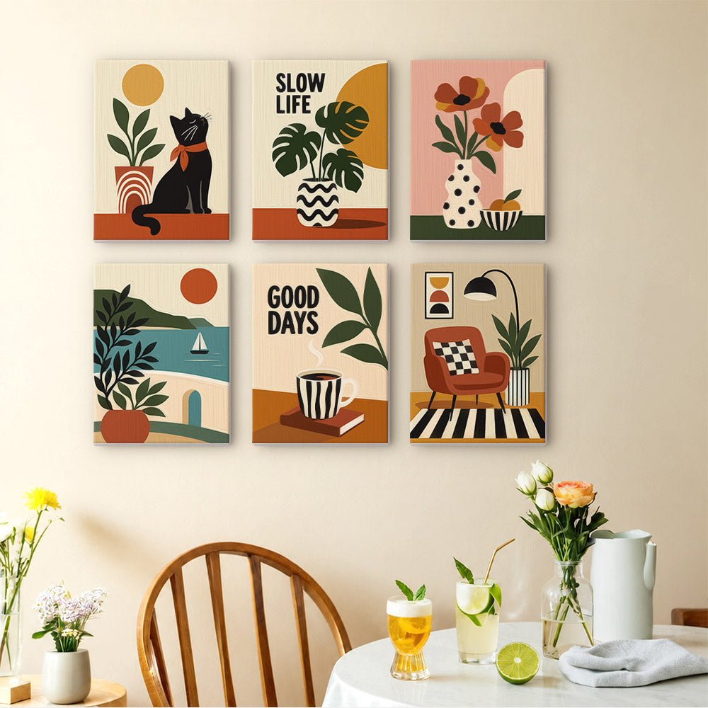 Slow Life mini paintings displayed as a gallery wall in a sunny kitchen