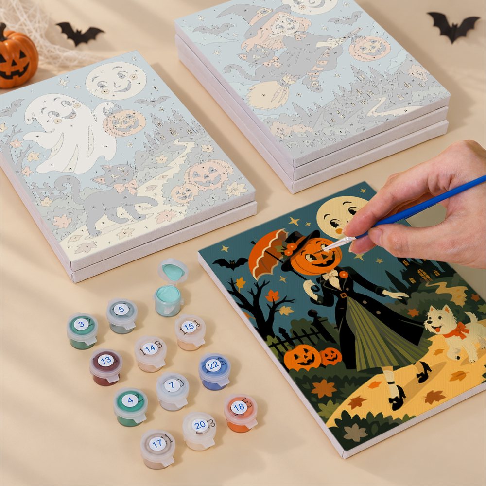 Painting one of the Smiling Moon Tales designs next to a stack of mini canvases