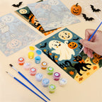 Filling in a Smiling Moon Tales mini canvas with numbered acrylic paints and a fine brush