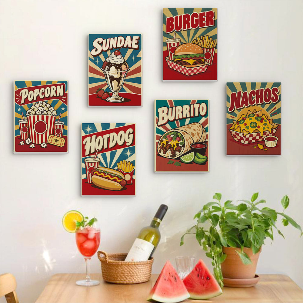 Six finished Snack Bar Classics mini paintings hung on a wall above a table
