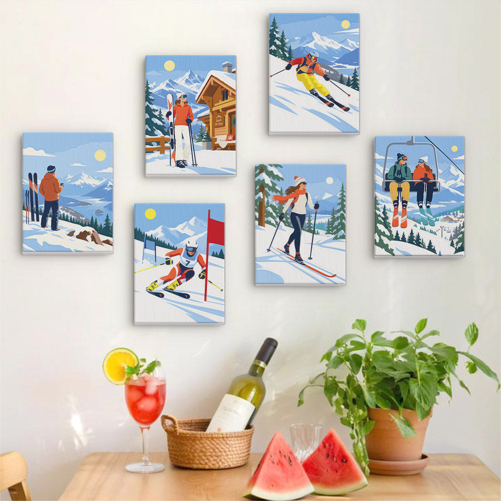 Six finished Snow Day Skiers mini paintings hung on a wall above a table