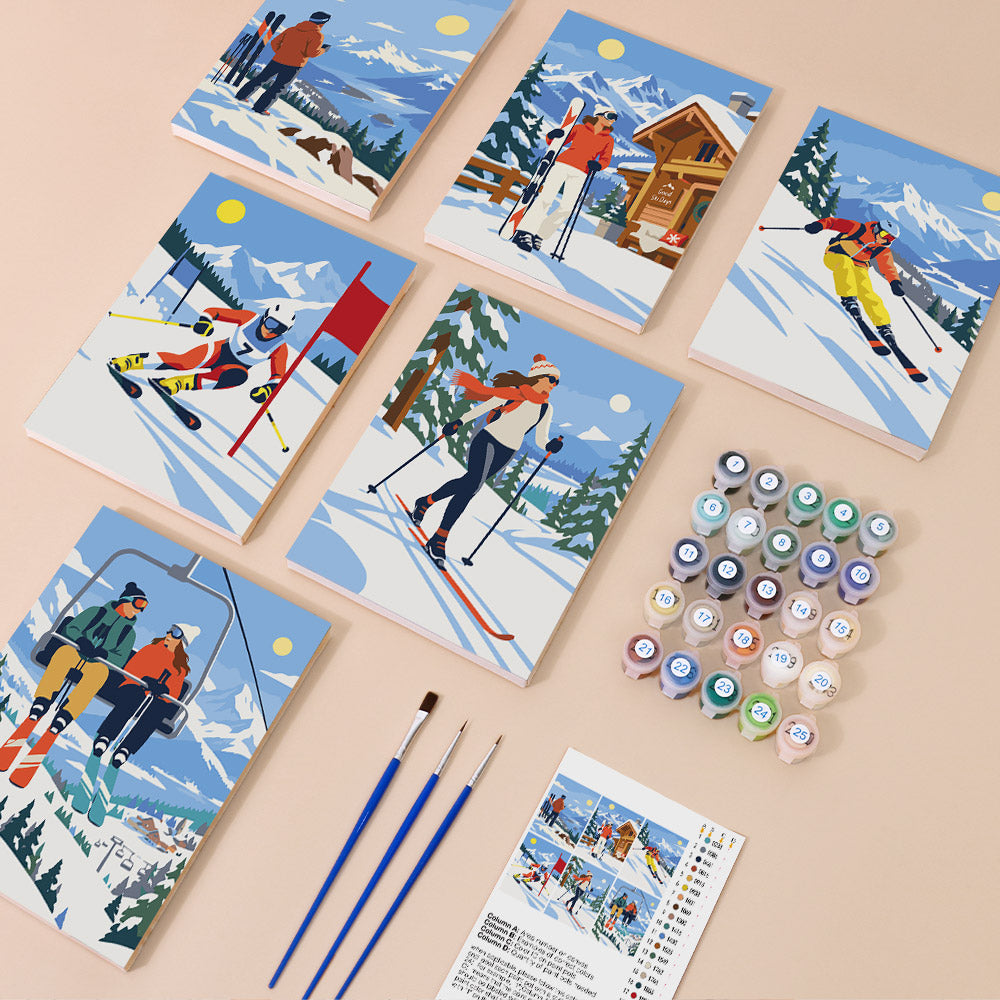 Snow Day Skiers mini paint by numbers kit with six numbered canvases, acrylic paints, brushes and layout