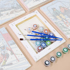 Numbered paint pots and brushes on a pre-stretched Snow Day Skiers mini canvas