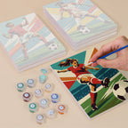 Painting one of the Soccer Glory designs next to a stack of mini canvases