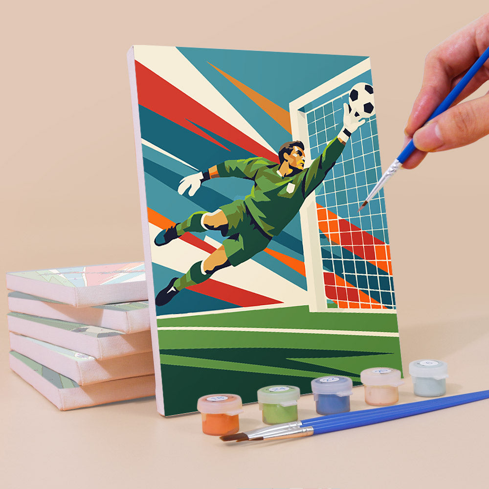 Painting a Soccer Glory mini canvas propped up beside numbered acrylic paints