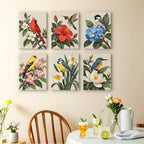 Songbird Blooms mini paintings displayed as a gallery wall in a sunny kitchen