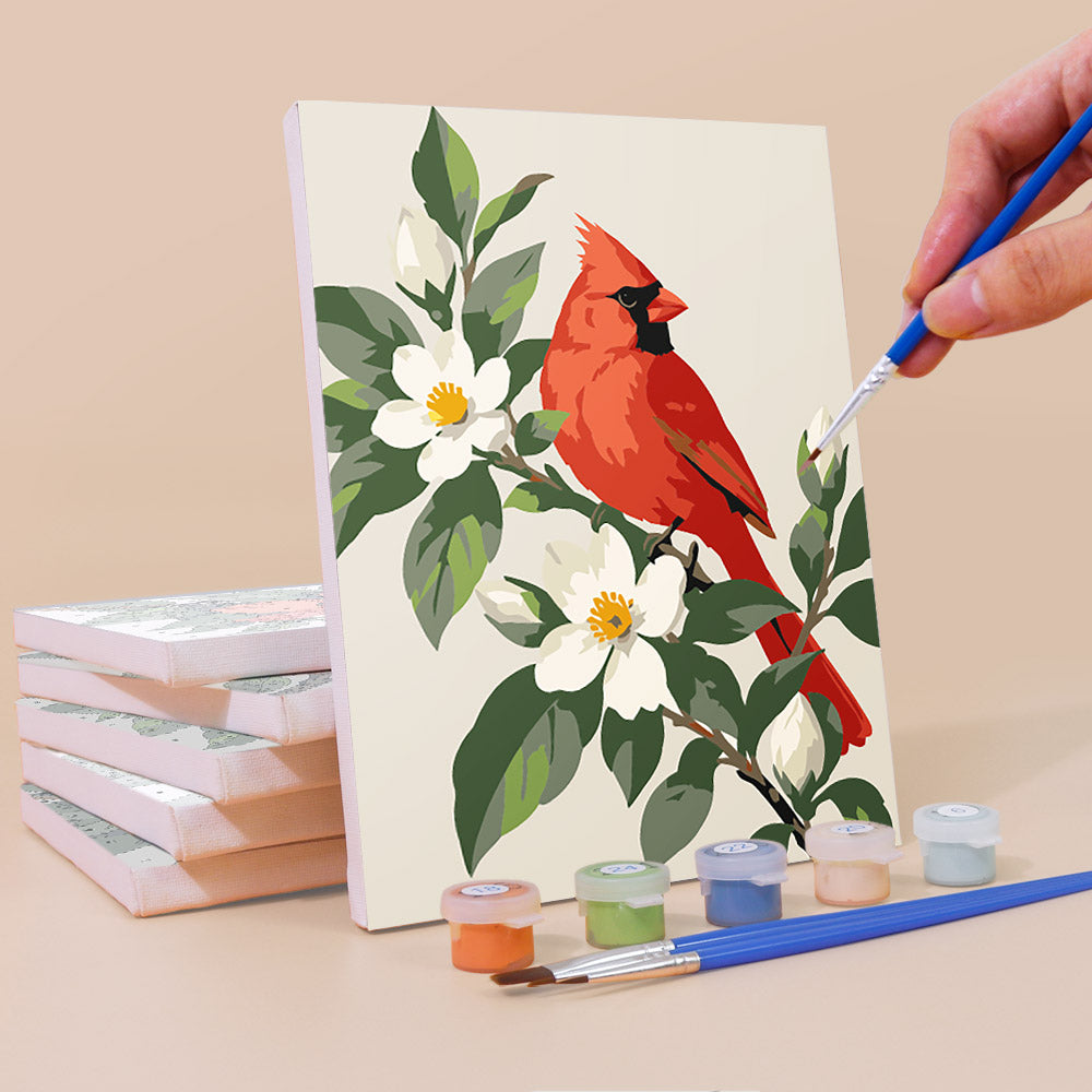 Painting a Songbird Blooms mini canvas propped up beside numbered acrylic paints
