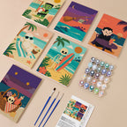 Spooky Beach Party mini paint by numbers kit with six numbered canvases, acrylic paints, brushes and layout