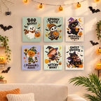 Six finished Spooky Cutie Sayings mini paintings hung on a wall above a table