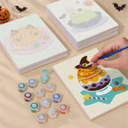 Painting one of the Spooky Dessert Bar designs next to a stack of mini canvases