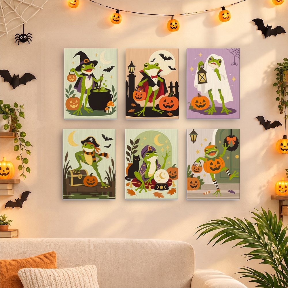 Six finished Spooky Frog Masquerade mini paintings hung on a wall above a table