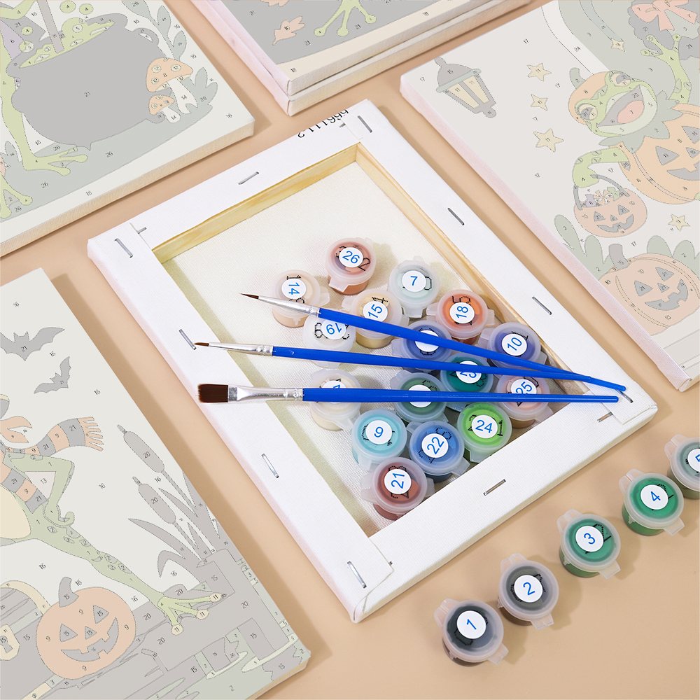 Numbered paint pots and brushes on a pre-stretched Spooky Frog Masquerade mini canvas
