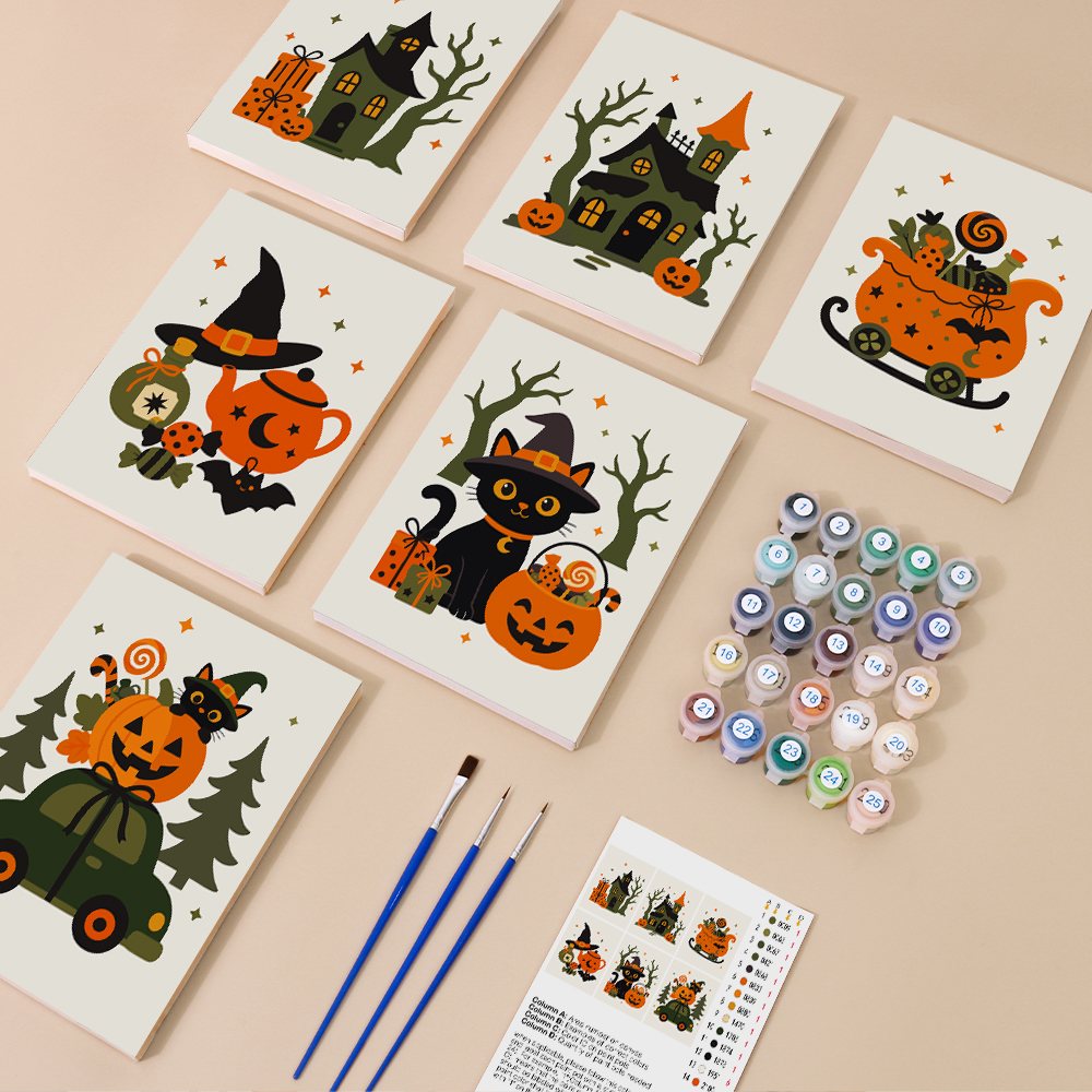 Painting one of the Spooky Holiday Crossover designs next to a stack of mini canvases