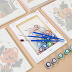 Spooky Holiday Crossover mini paintings displayed as a gallery wall in a sunny kitchen