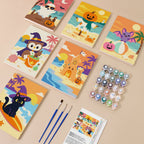 Painting one of the Spooky Summer Beach designs next to a stack of mini canvases