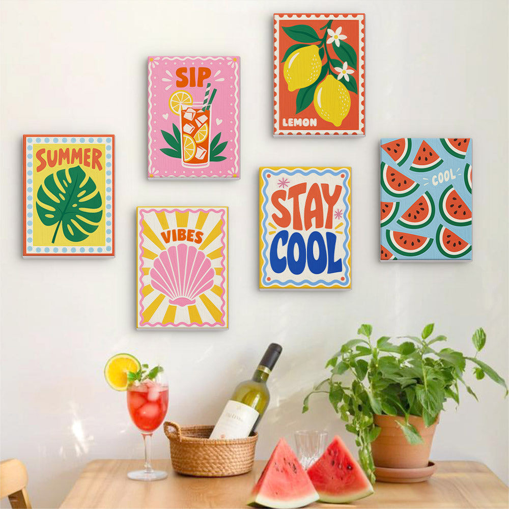 Six finished Stay Cool Summer mini paintings hung on a wall above a table