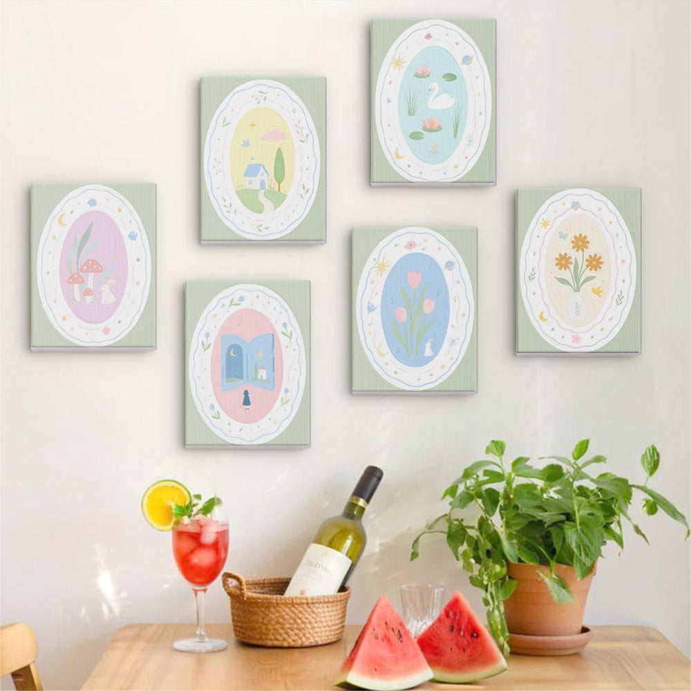 Six finished Storybook Cameos mini paintings hung on a wall above a table