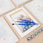 Numbered paint pots and brushes on a pre-stretched Storybook Cameos mini canvas