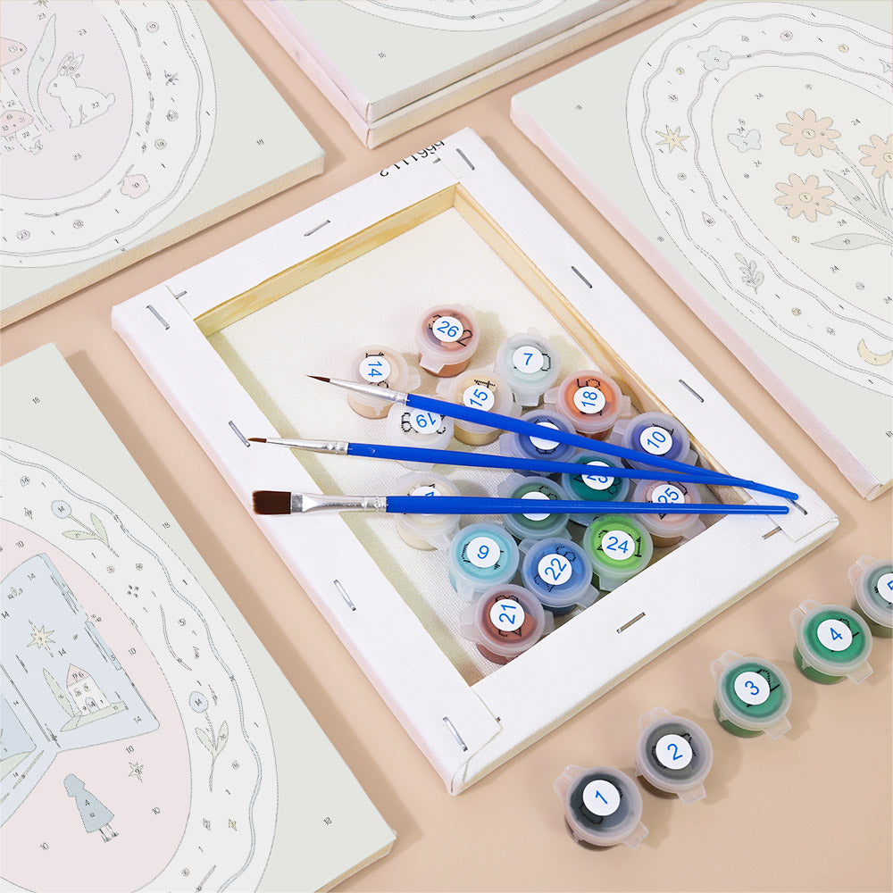 Numbered paint pots and brushes on a pre-stretched Storybook Cameos mini canvas