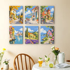 Storybook Villages mini paintings displayed as a gallery wall in a sunny kitchen