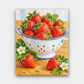 Strawberry Colander paint by numbers kit of fresh strawberries in a white enamel colander on a wooden table with blossoms