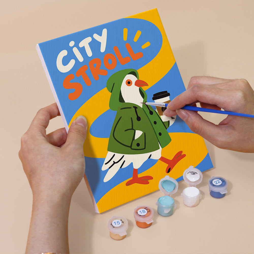 Hand holding a Street Pigeons mini canvas while painting the details