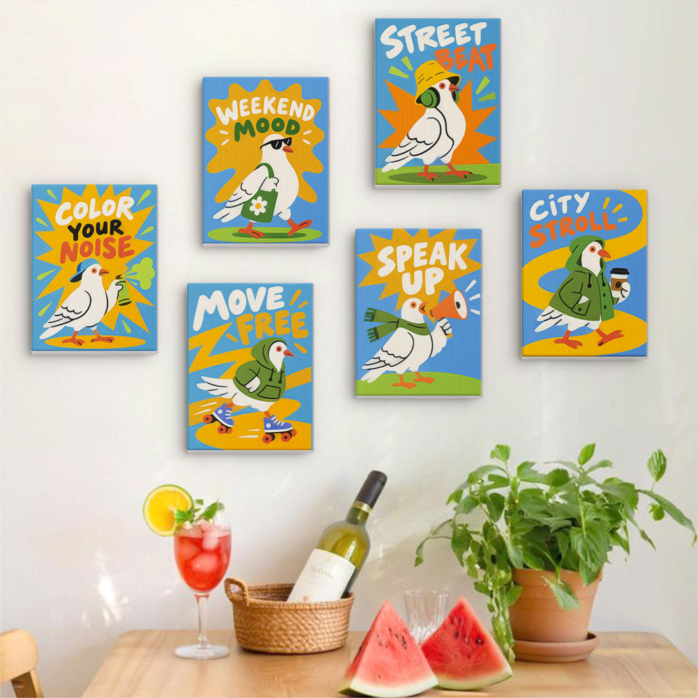 Six finished Street Pigeons mini paintings hung on a wall above a table