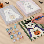 Painting one of the Striped Ghosties designs next to a stack of mini canvases