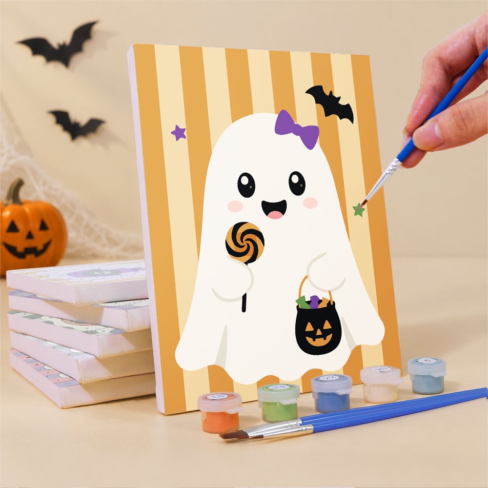 Painting a Striped Ghosties mini canvas propped up beside numbered acrylic paints