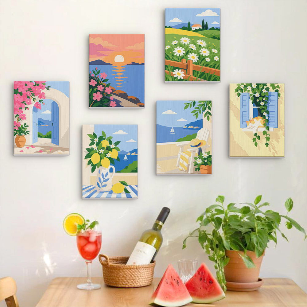 Six finished Summer Escapes mini paintings hung on a wall above a table