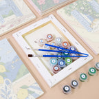Numbered paint pots and brushes on a pre-stretched Summer Escapes mini canvas
