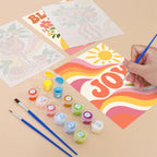 Filling in a Summer Glow mini canvas with numbered acrylic paints and a fine brush