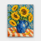Sunflowers in a Cobalt Jug paint by numbers kit of yellow sunflowers in a cobalt blue jug on a striped orange tablecloth