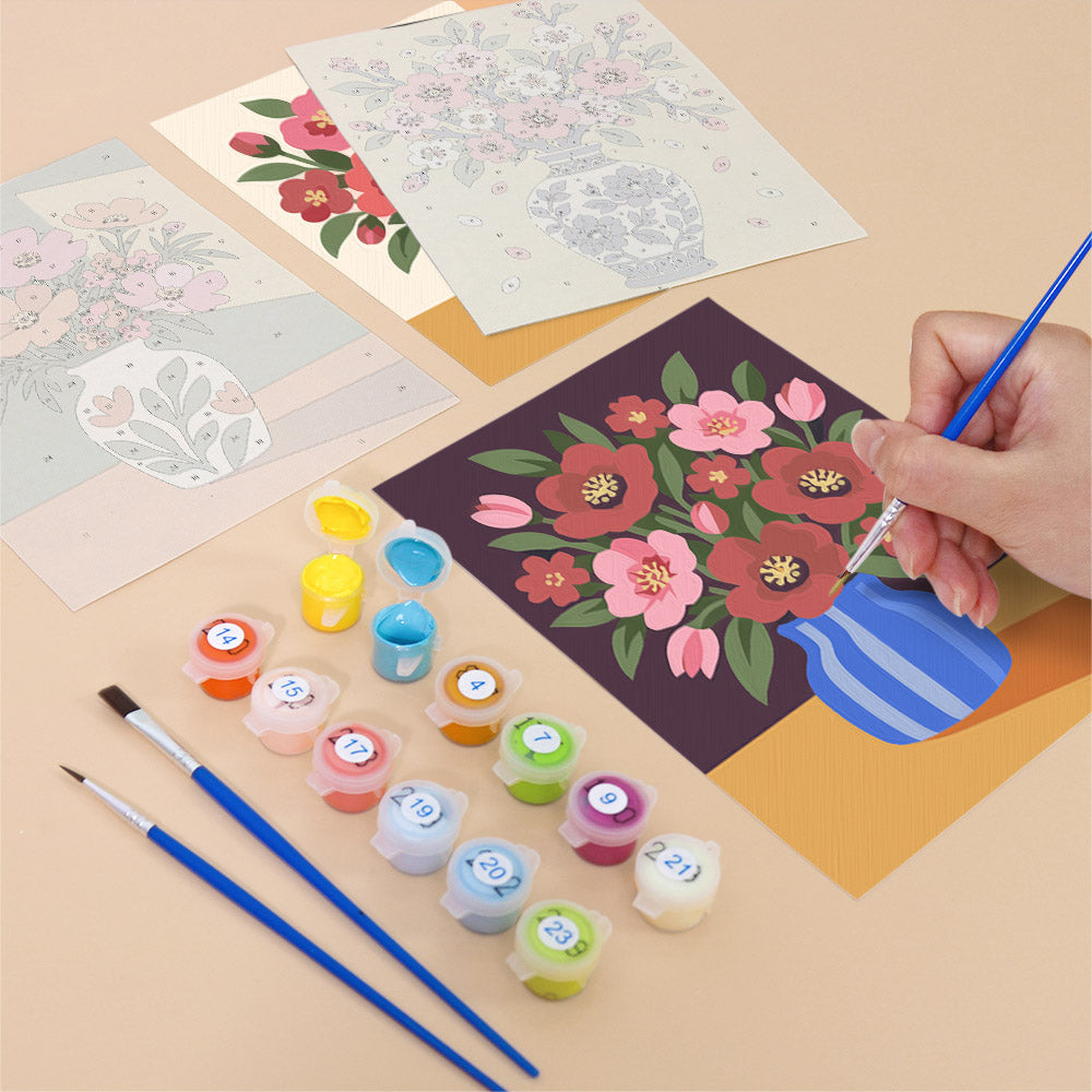 Filling in a Sunlit Bouquets mini canvas with numbered acrylic paints and a fine brush
