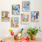 Six finished Sunny Doorways mini paintings hung on a wall above a table