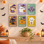 Painting a Sweet Little Spooks mini canvas propped up beside numbered acrylic paints