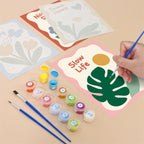 Filling in a Sweet Sayings mini canvas with numbered acrylic paints and a fine brush