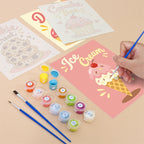 Filling in a Sweet Shop mini canvas with numbered acrylic paints and a fine brush